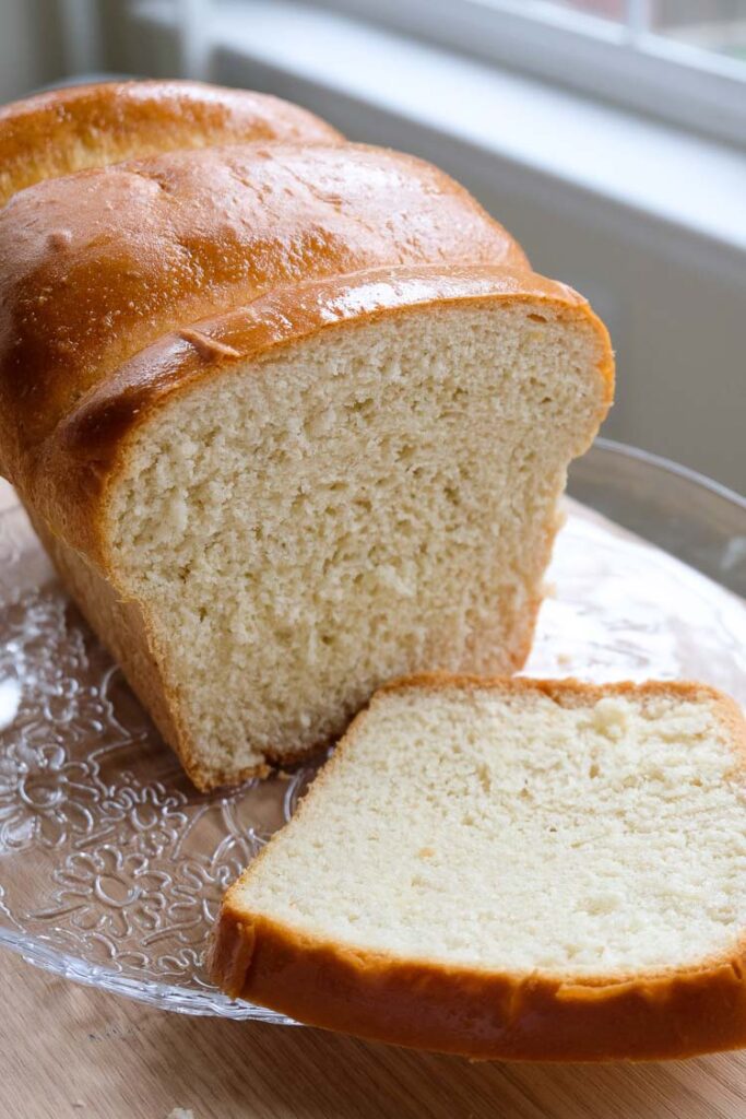 The best vegan brioche bread sliced on a plate.