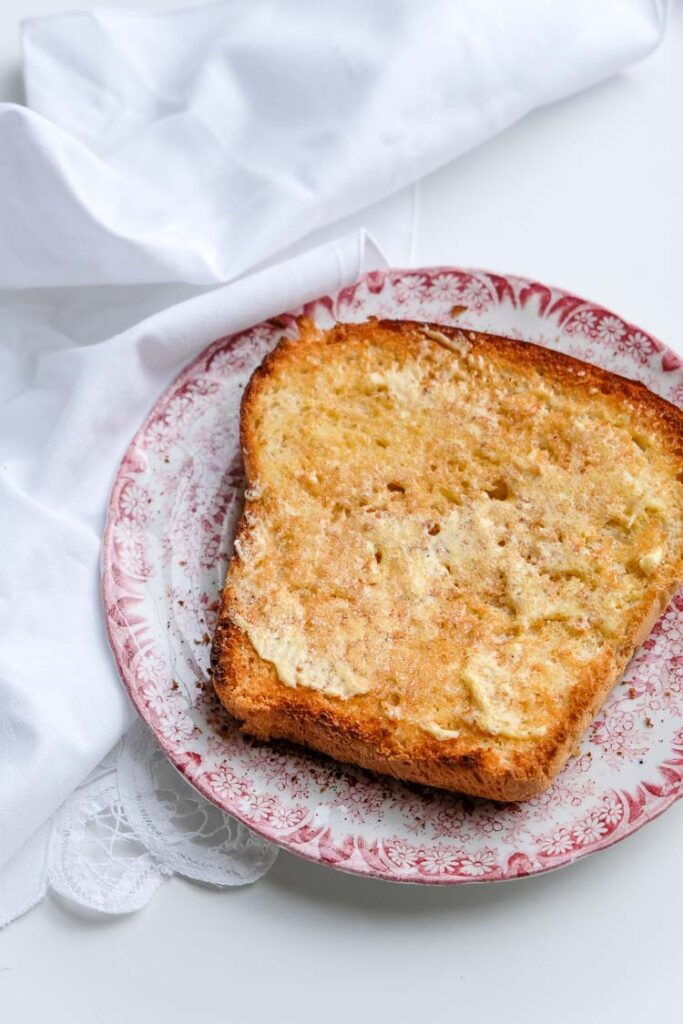 Vegan brioche toasted with vegan butter and cinnamon sugar.